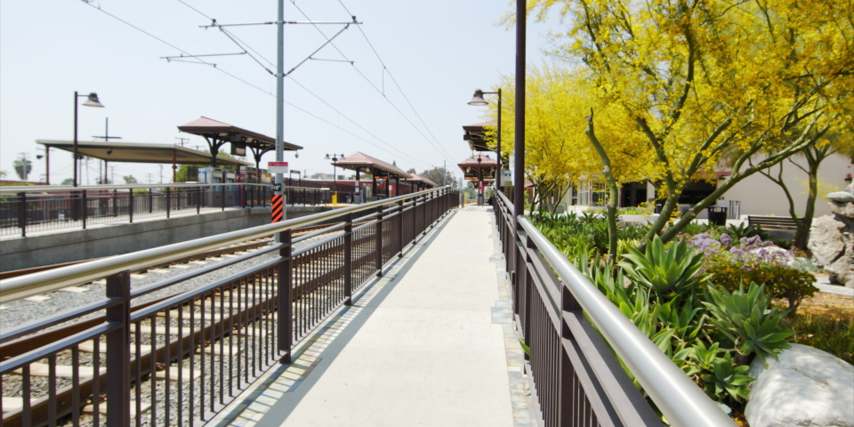 Panning Walkway And Tracks At A Metro Train Station Depot On A Sunny Day - Los Angeles, California
