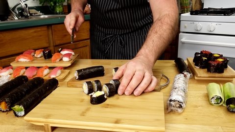 Home cooking - Cutting or slicing sweet omelet sushi roll into editable chunks.
