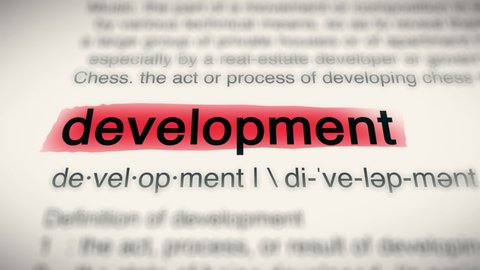 Sukabumi, Indonesia, April 25 2022: The Word Development Red Highlighted in a Dictionary Animation