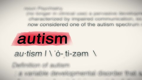 Sukabumi, Indonesia, April 25 2022: The Word Autism Red Highlighted in a Dictionary Animation