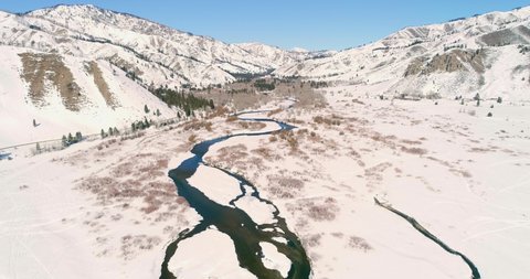 Anderson Ranch Reservoir Idaho head waters on a sunny snowy winter day drone 4k footage