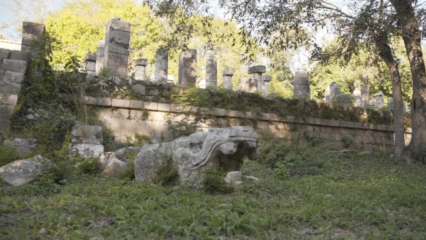 Ancient Mayan Ruins With Stone Pillars And Stone Serpent Head In Yucatan Peninsula, Mexico. - Medium Shot