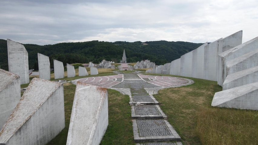 Uzice , Serbia - 04 26 2022: Aerial View of Kadinjaca WWII Memorial Complex on Hill Under Dark Clouds