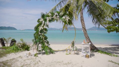 Wedding decor beach set up seaside floral arch cloudy sunny summer. Best Wedding Western details green garden concept. Setting stage arch marriage patterns tropical island sunset. Close up 2022.