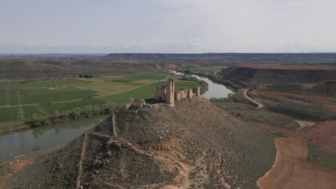 Aerial video in 4k of the ruins of the old medieval castle of Palma and its hermitage in the municipality of Sastago, in the province of Zaragoza.
