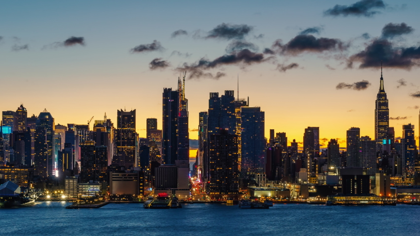 Midtown Manhattan skyline at sunrise in New York, timelapse of rising sun Royalty-Free Stock Footage #1089712453