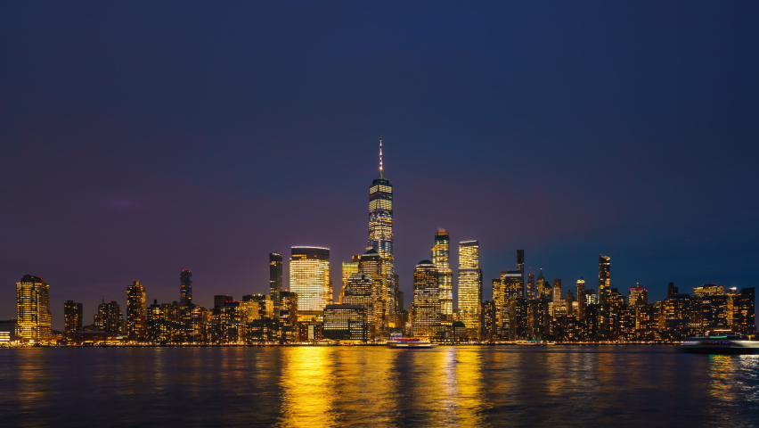 Downtown Manhattan skyline at dusk, New York city, timelapse of day to night transition