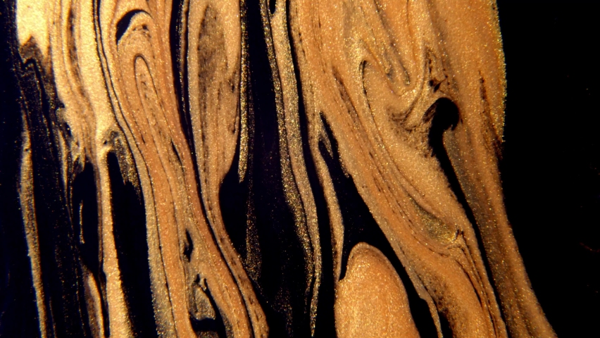 Fluid art drawing video flowing effect. Liquid paint mixing artwork with splash and swirl. Abstract gold background.