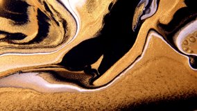 Fluid art drawing video flowing effect. Liquid paint mixing artwork with splash and swirl. Abstract gold background.