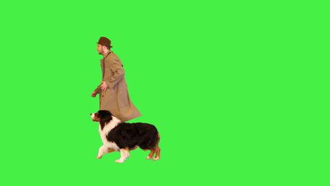 Detective running with his australian shepherd dog on a Green Screen, Chroma Key.