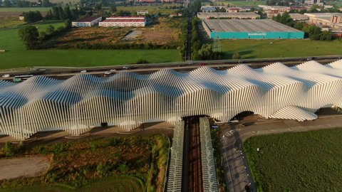 Reggio emilia ,italy,01 04 2022 :high speed railway train station av mediopadana aerial view drone