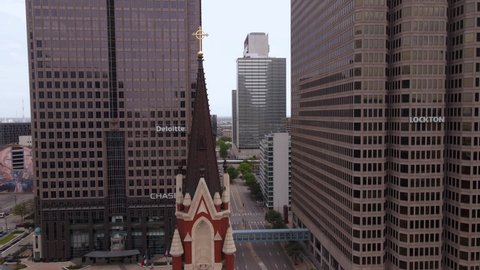 Dallas , United States - 04 26 2022: Aerial view around the bell tower of the Cathedral Shrine of the Virgin of Guadalupe, in Dallas, USA - circling, drone shot
