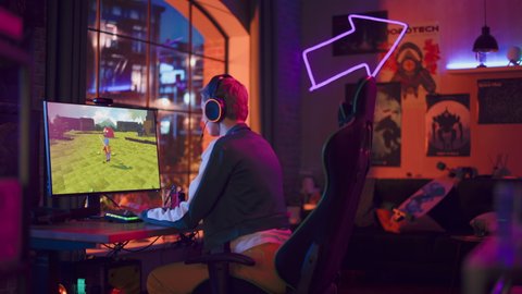 Excited Female Gamer Playing MMORPG Video Game on Her Personal Computer in Which Players Fight in a Tournament. Room and PC with Neon Led Lights. Stylish Young Woman in Cozy Room at Home.