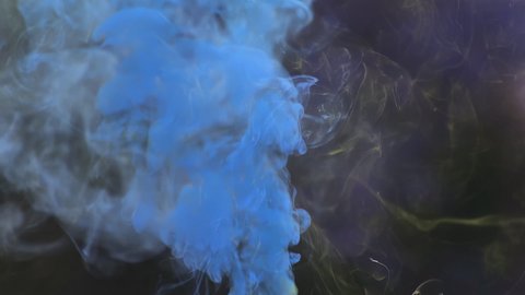 View of blue smoke on a black background.