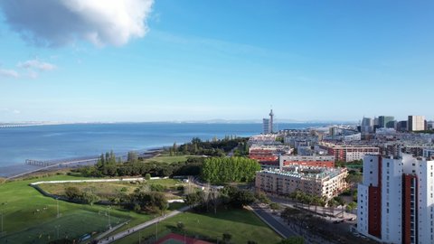 Lisbon, Portugal, April 24, 2022: DRONE AERIAL FOOTAGE - The Vasco da Gama Tower and Myriad Hotel at Park of Nations in Lisbon. Modern residential neighborhood with contemporary architecture.