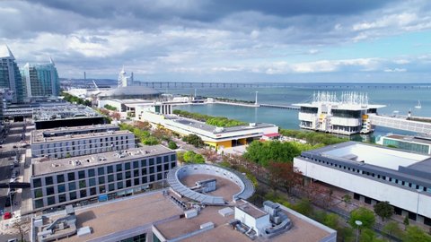 Lisbon, Portugal, April 24, 2022: DRONE AERIAL FOOTAGE: The Parque das Nacoes (Park of Nations), is a neighborhood in Lisbon constructed for the 1998 Lisbon World Exposition.