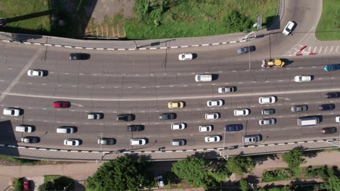 Transport Aerials - top down view of freeway busy city rush hour heavy traffic jam highway bridge.