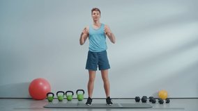 Online Fitness Course Video with Young Athletic Personal Trainer Explaining Cardio Workout Routine Starting with High Knees Exercise. Fit Man Showing How to Lose Body Weight. HUD Interactive Graphics.