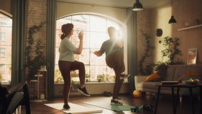 Smiling Elderly Couple Doing Fun Cardio Exercises Together at Home in Sunny Living Room. Senior Man and Woman Give Each Other High Five for Motivation. Healthy Lifestyle and Fitness Concept. - Powered by Shutterstock - Get 15% off with code: PIKWIZARD15