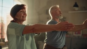 Close Up Portrait of a Senior Couple Doing Gymnastics and Yoga Stretching Exercises Together at Home on Sunny Morning. Concept of Healthy Lifestyle, Fitness, Recreation, Couple Goals and Retirement. - Powered by Shutterstock - Get 15% off with code: PIKWIZARD15