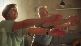 Close Up Portrait of a Senior Couple Doing Gymnastics and Yoga Stretching Exercises Together at Home on Sunny Morning. Concept of Healthy Lifestyle, Fitness, Recreation, Couple Goals and Retirement. - Powered by Shutterstock - Get 15% off with code: PIKWIZARD15