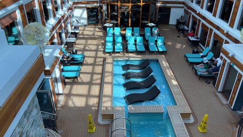 Orlando, FL USA - January 8, 2022: Zooming in on the Haven Pool on the Norwegian Cruise Lines Escape cruise ship in Port Canaveral, Florida.