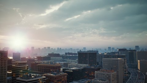 View to the motorway intersection in New York. Active urban traffic in the megapolis at sunrise. Expressway, high skyscrapers downtown on horizon. Drone top shots. USA, North America. High quality 4k