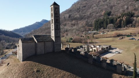 Aerial view of the small ancient church of St. Alexander, an example of the widespread Romanesque rural architecture of XII century in the Como area (Italy).