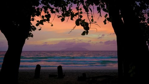 Sunset at the Beau Vallon Beach on the island of Mahe, Seychelles. Beau Vallon Beach is well-frequented and is possibly the most popular beach on the island. 4K UHD video.