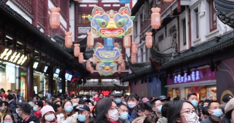 Shanghai.China-Feb.1st 2022: crowded Chinese tourists in face mask to prevent covid-19, walking at Yuyuan garden to watch lanterns during traditional Chinese new year