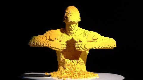 Europe, Italy , MIlan April 2022 - The Art Of The Brick EXPO is the new Lego exposition of the USA artist Nathan Sawaya - Yellow man 3d prospettive Lego Sculpture 