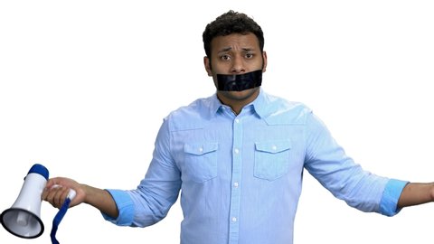 Emotional man with taped mouth can not speak. Isolated on white background. Censorship concept.