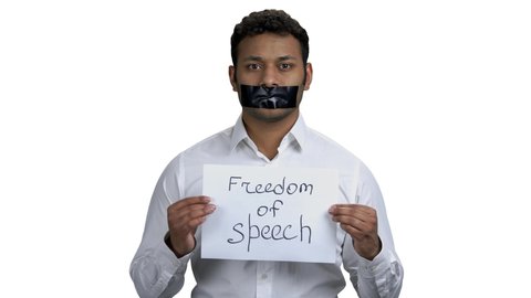 Businessman with taped mouth on white background. Censorship and freedom of speech.