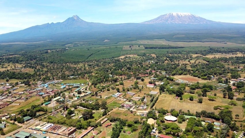 Aerial drone view Open Air market in the Loitokitok town, Kenya and mount Kilimanjaro- Rural village of Kenya. Rural settlement Kenya