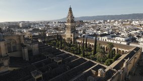 Drone pov of Islamic Mosque and Catholic Cathedral of Cordoba in Spain