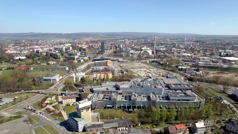 Panorama of the city of Olomouc with passing cars and public transport around the Šantovka department store, Czech Republic - aerial view