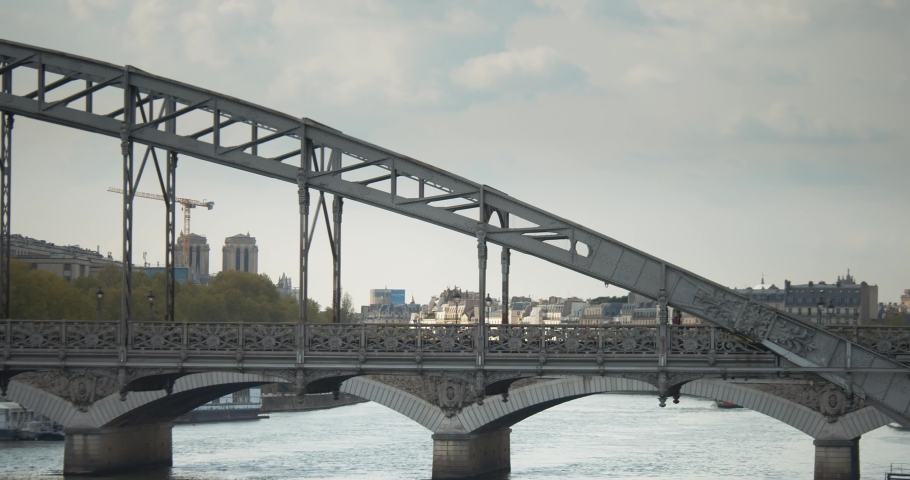 A Train Ride Crossing Over The Bridge In Paris, France. Static Shot