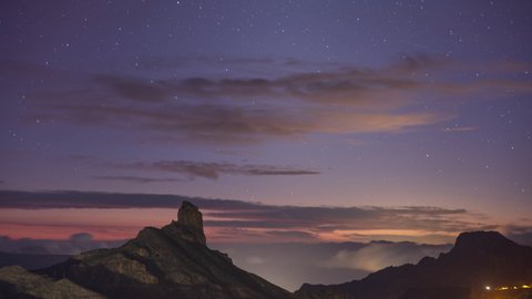 A night time starlapse of the roque nublo in gran canaria, canary islands at night