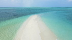 Tropical beach sandbank with beautiful blue transparent water and white sand. Perfect vacation holiday travel destination to relax. Aerial drone video footage. 4k 60 fps. Atoll island.