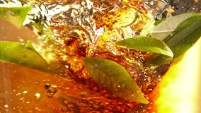 Super Slow Motion Shot of Pouring Tea into Whirl with Green Leaves at 1000fps. - Powered by Shutterstock - Get 15% off with code: PIKWIZARD15