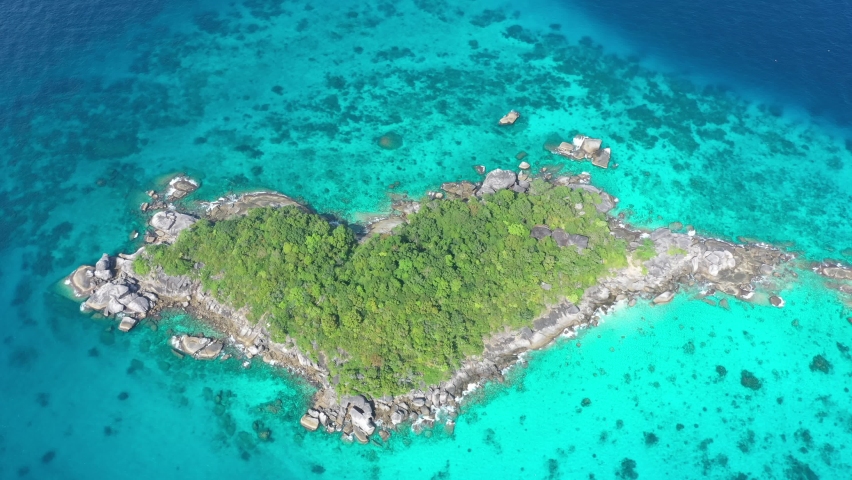 Aerial top view of beautiful natural heart shape island at Similan Islands, seascape at summer time for holidays. Turquoise blue ocean tropical sea in Krabi, Thailand. Royalty-Free Stock Footage #1089750381