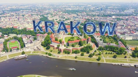 Inscription on video. Krakow, Poland. Wawel Castle. Ships on the Vistula River. View of the historic center. Blue lights form luminous. Electric style, Aerial View, Departure of the camera
