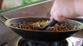Caucasian Man Stir Frying Vegetables In Wok for Thai Spring Rolls Asian Cooking Class Koh Samui Thailand - Powered by Shutterstock - Get 15% off with code: PIKWIZARD15