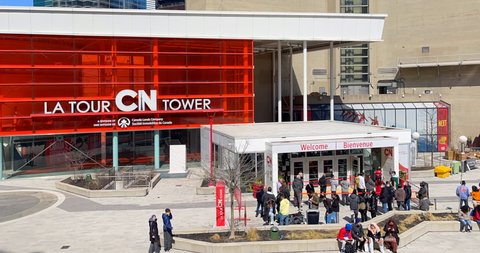 Toronto, Canada - April 29, 2022: People lining up to enter the CN Tower