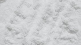 Maltodextrin, dextrose background footage. White powder texture video. Diet supplement, glucosamine, fructose. Collagen or protein, sport bioadditive like lysine, guarana, valine spreading by spatula