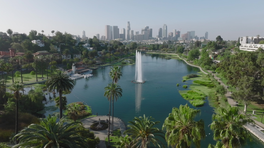 flying counter clockwise view of Echo Park Lake and downtown LA skyline