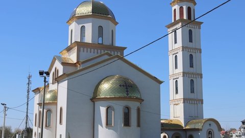 Belgrade, Serbia - April 13, 2022: Saint Matthew the Apostle Serbian Orthodox Church Building in Surcin tilt down.