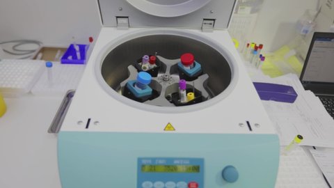 Medical centrifuge operation. Laboratory centrifuge. Rotation of medical samples in a laboratory centrifuge.