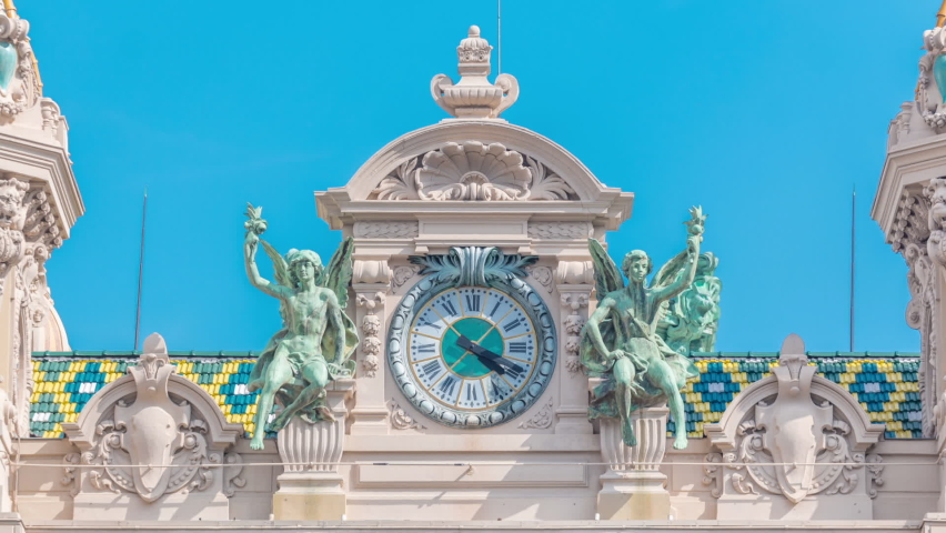 lock on top of the 19th century baroque style palace of the Monte Carlo Casino timelapse in Monaco. Blue sky at summer day