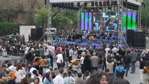 Yerevan, Armenia - April 30, 2022 - People gather around at Cascade Complex to listen to the Jazz Festival in Yerevan, Armenia